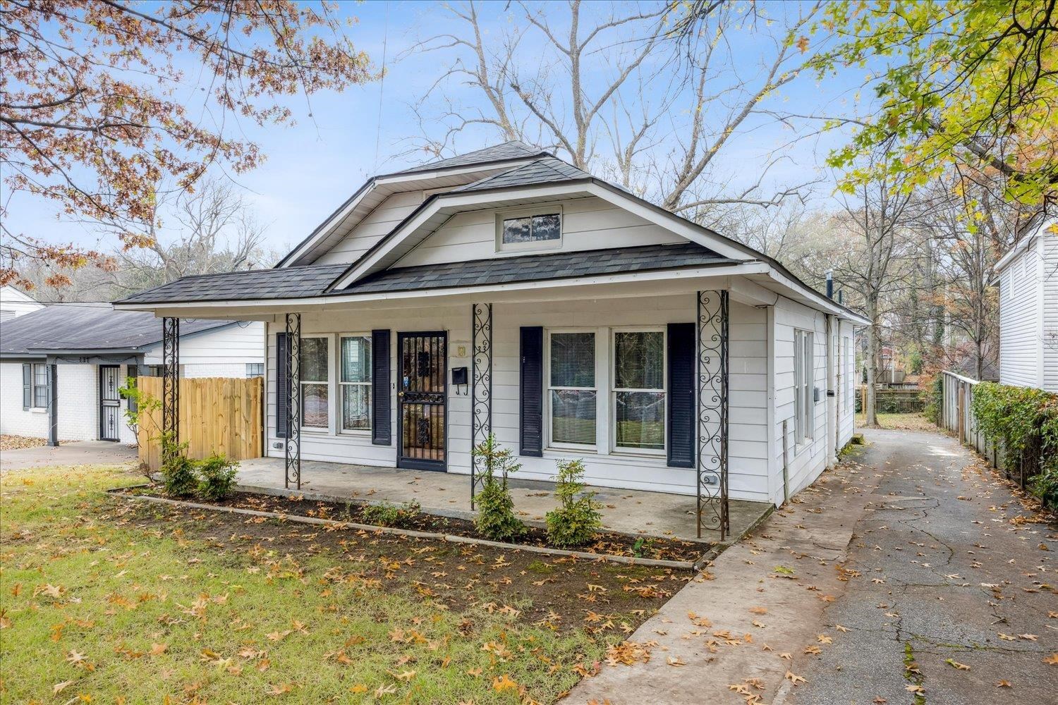 133 South Fenwick Road Memphis, TN 38111 - Photo 21 of 21 a front view of a house with a yard outdoor seating and garage