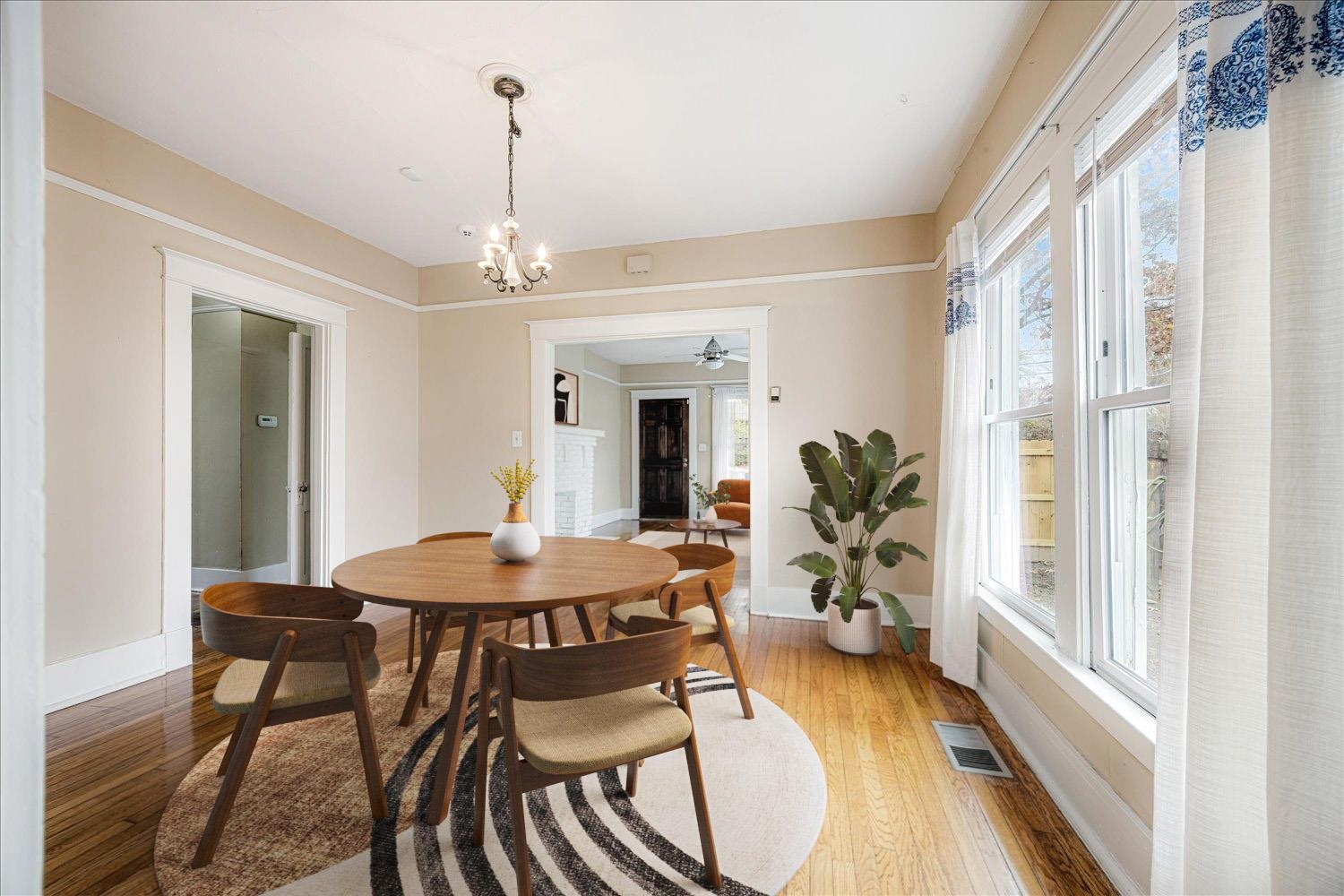 133 South Fenwick Road Memphis, TN 38111 - Photo 6 of 21 a dining room with furniture potted plants and wooden floor