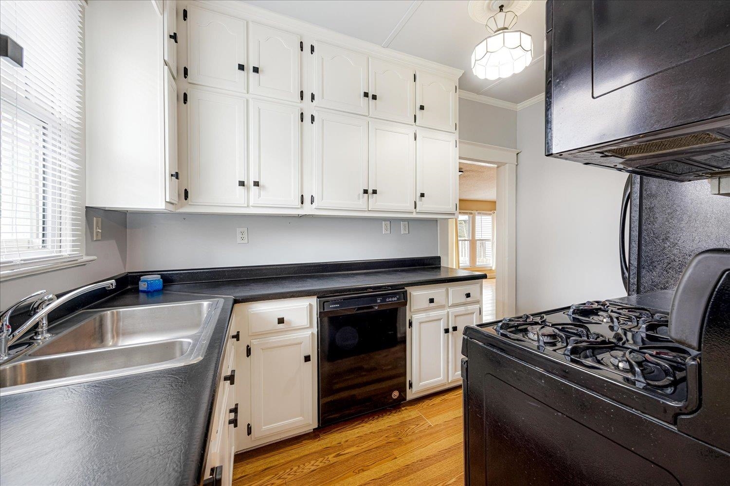133 South Fenwick Road Memphis, TN 38111 - Photo 7 of 21 a kitchen with granite countertop a stove and a sink