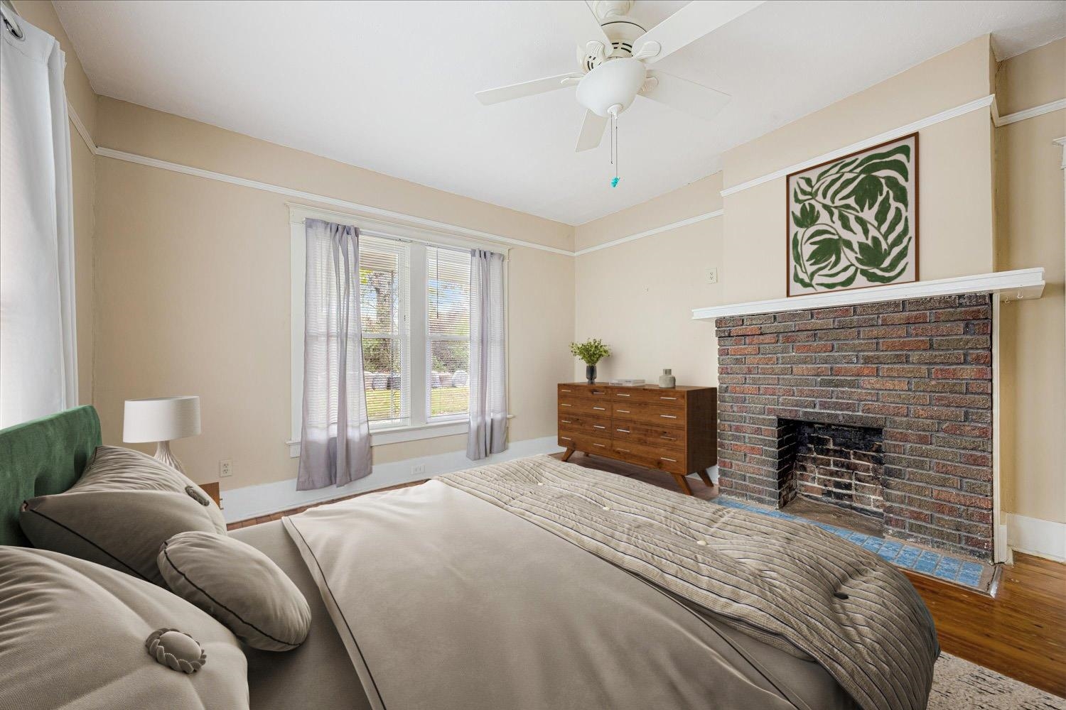 133 South Fenwick Road Memphis, TN 38111 - Photo 9 of 21 a bedroom with a bed and a fireplace