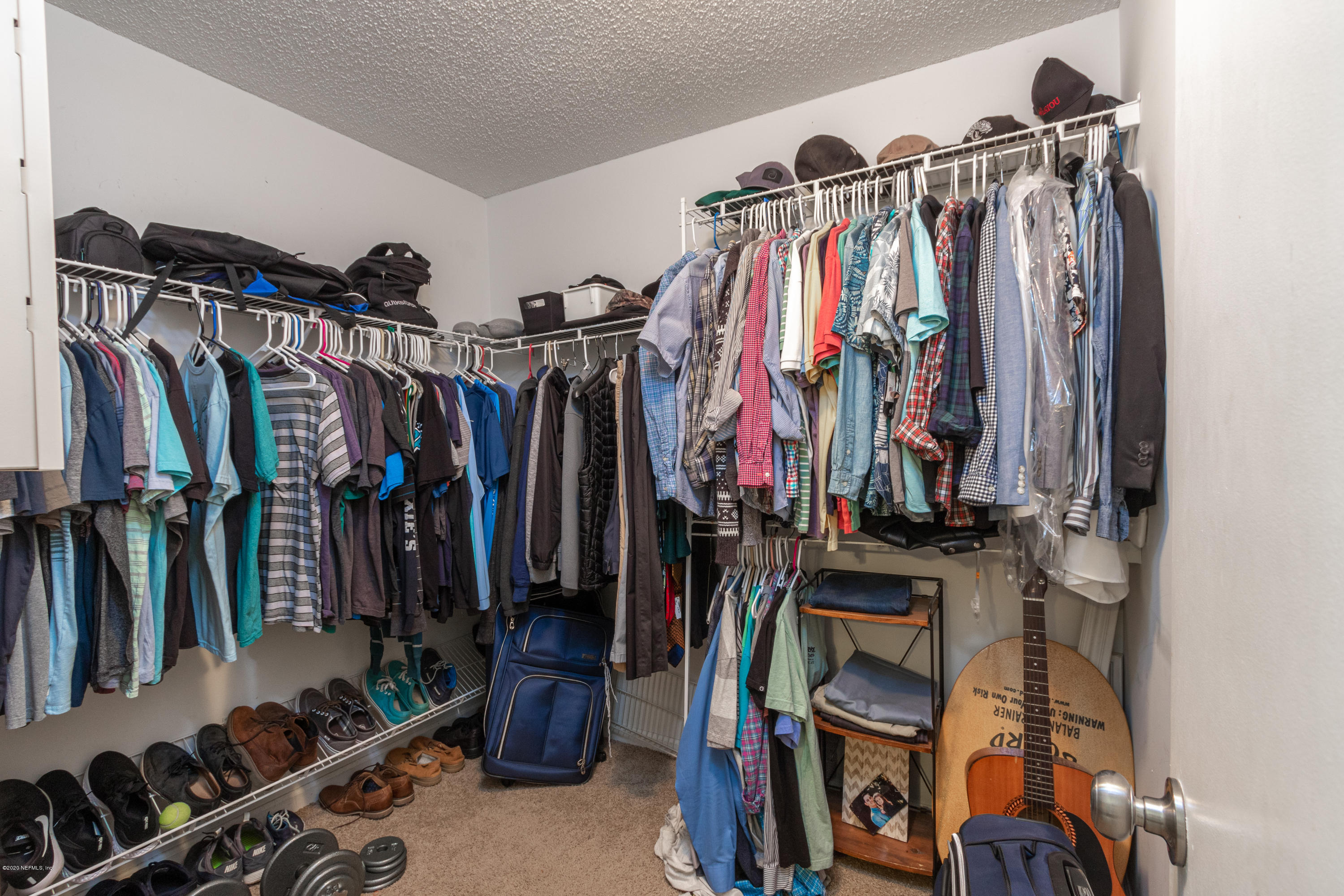 1214 Raleigh Ridge Drive Jacksonville, FL 32225 - Photo 12 of 25 a view of walk in closet with clothes