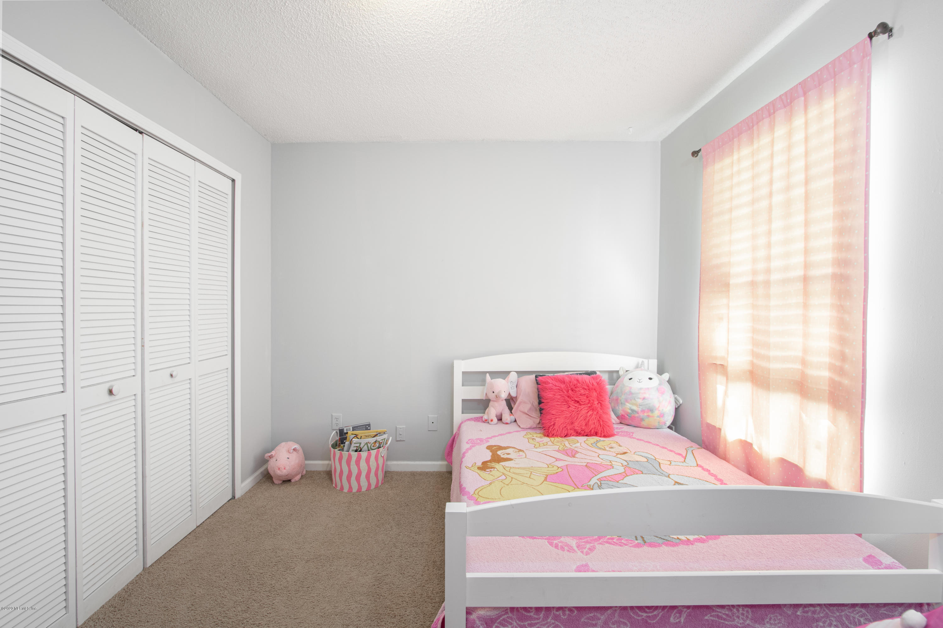 1214 Raleigh Ridge Drive Jacksonville, FL 32225 - Photo 16 of 25 a bedroom with a bed and window