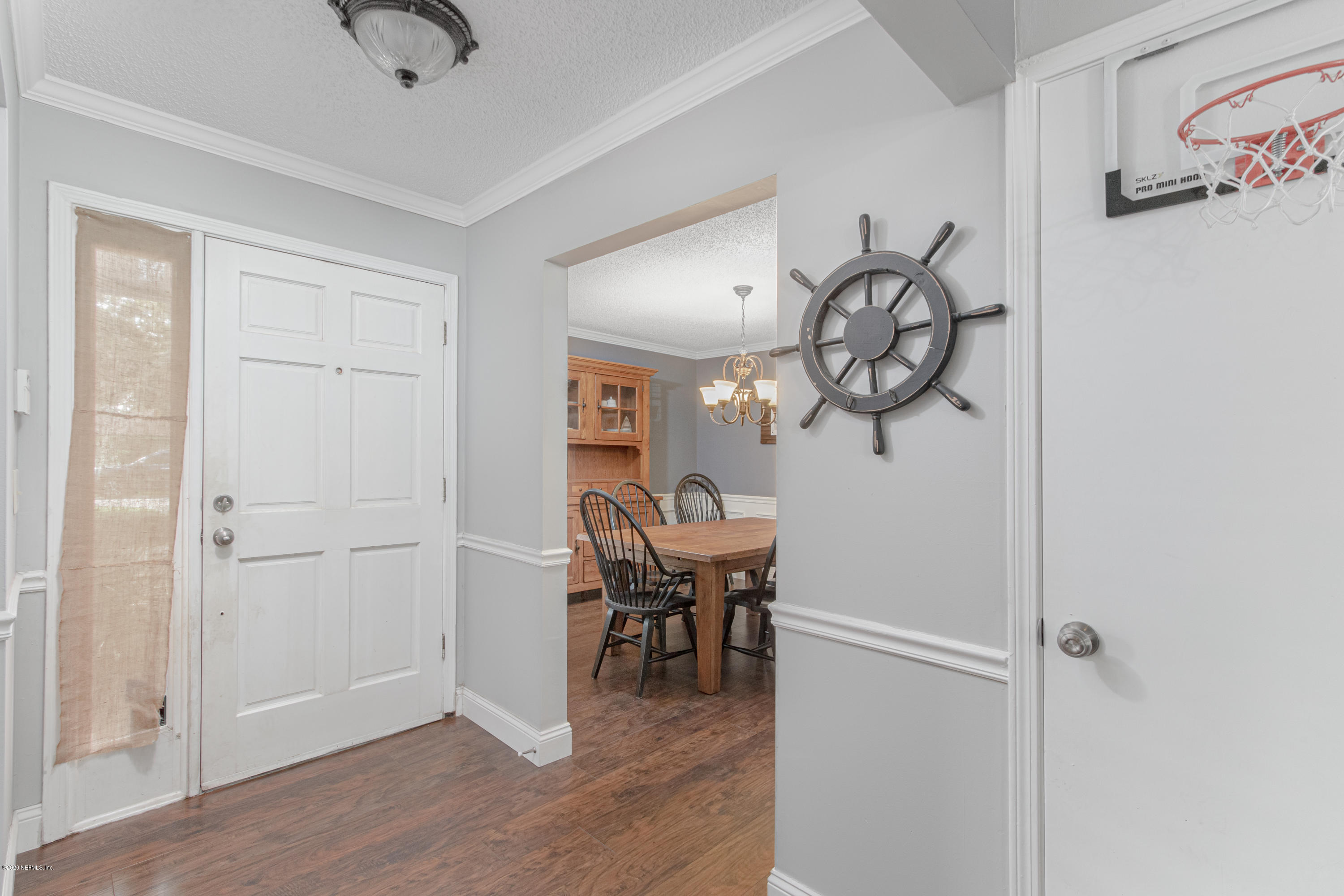 1214 Raleigh Ridge Drive Jacksonville, FL 32225 - Photo 18 of 25 a view of a room with wooden floor table and chairs