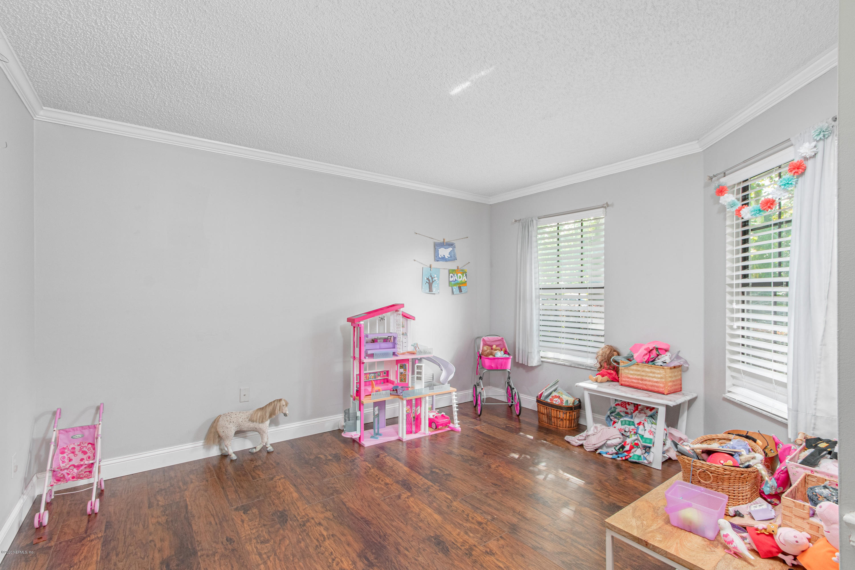 1214 Raleigh Ridge Drive Jacksonville, FL 32225 - Photo 20 of 25 a living room with furniture and a wooden floor