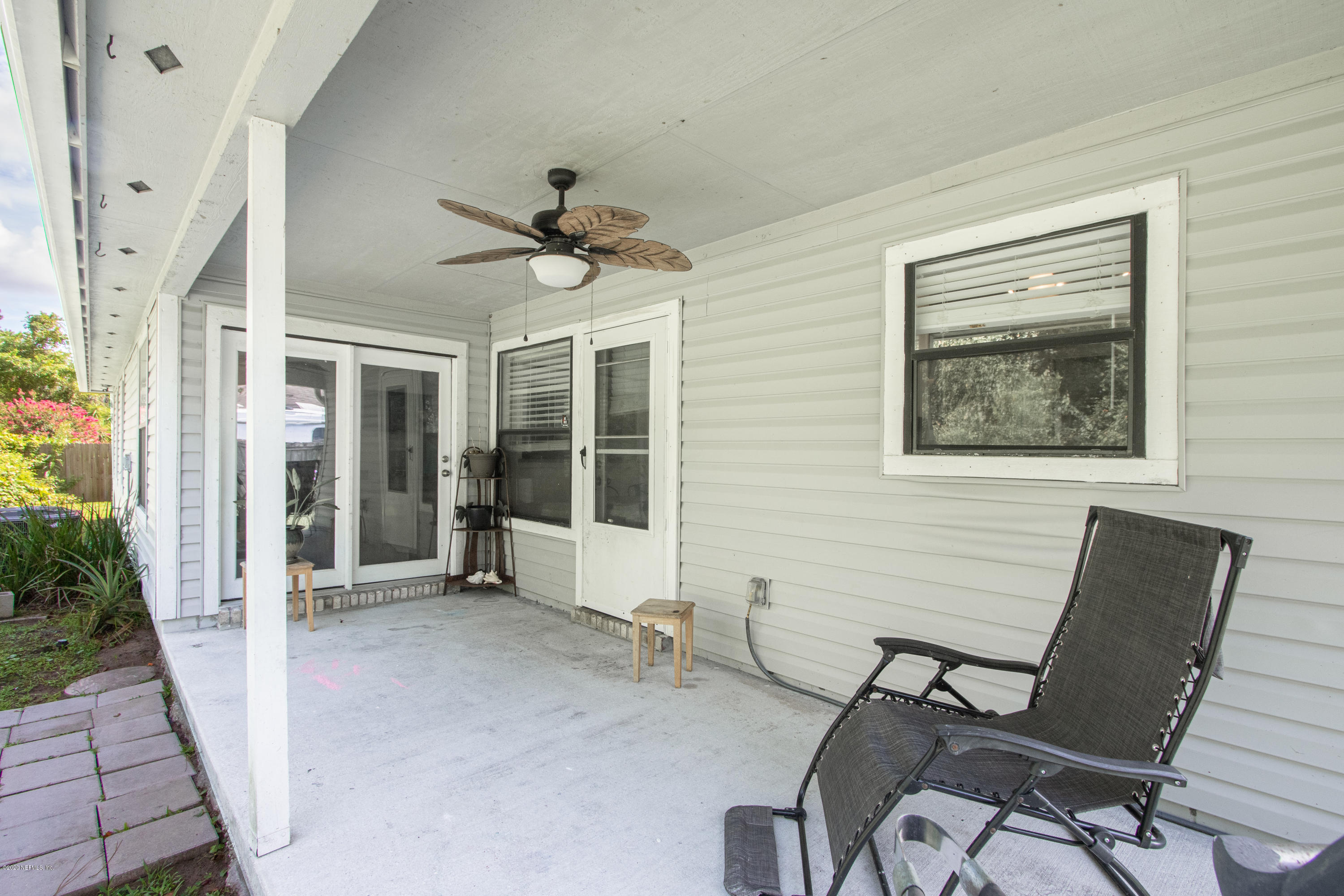 1214 Raleigh Ridge Drive Jacksonville, FL 32225 - Photo 22 of 25 a view of a livingroom with furniture and a large window