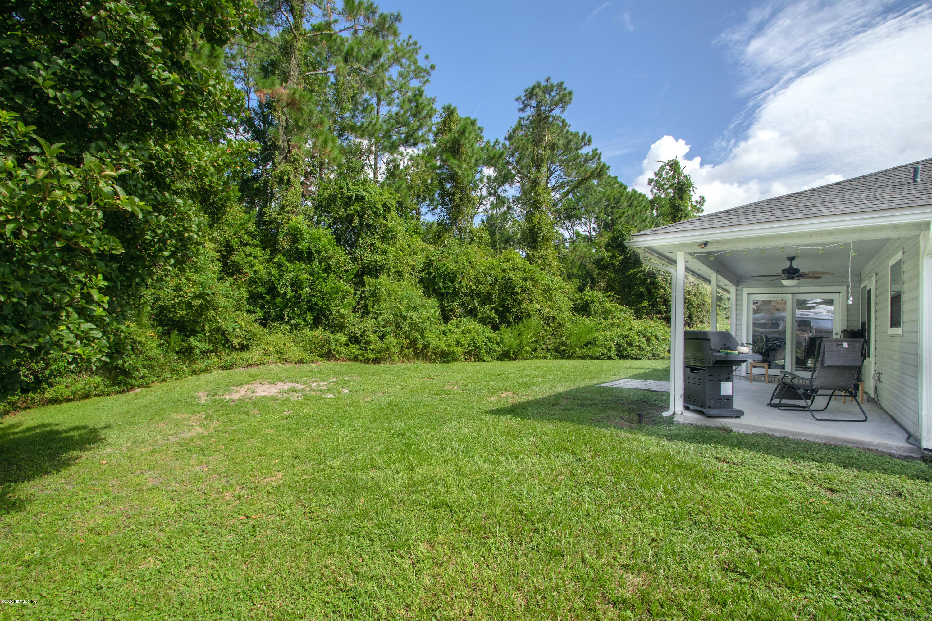 1214 Raleigh Ridge Drive Jacksonville, FL 32225 - Photo 24 of 25 a view of a patio with table and chairs and potted plants