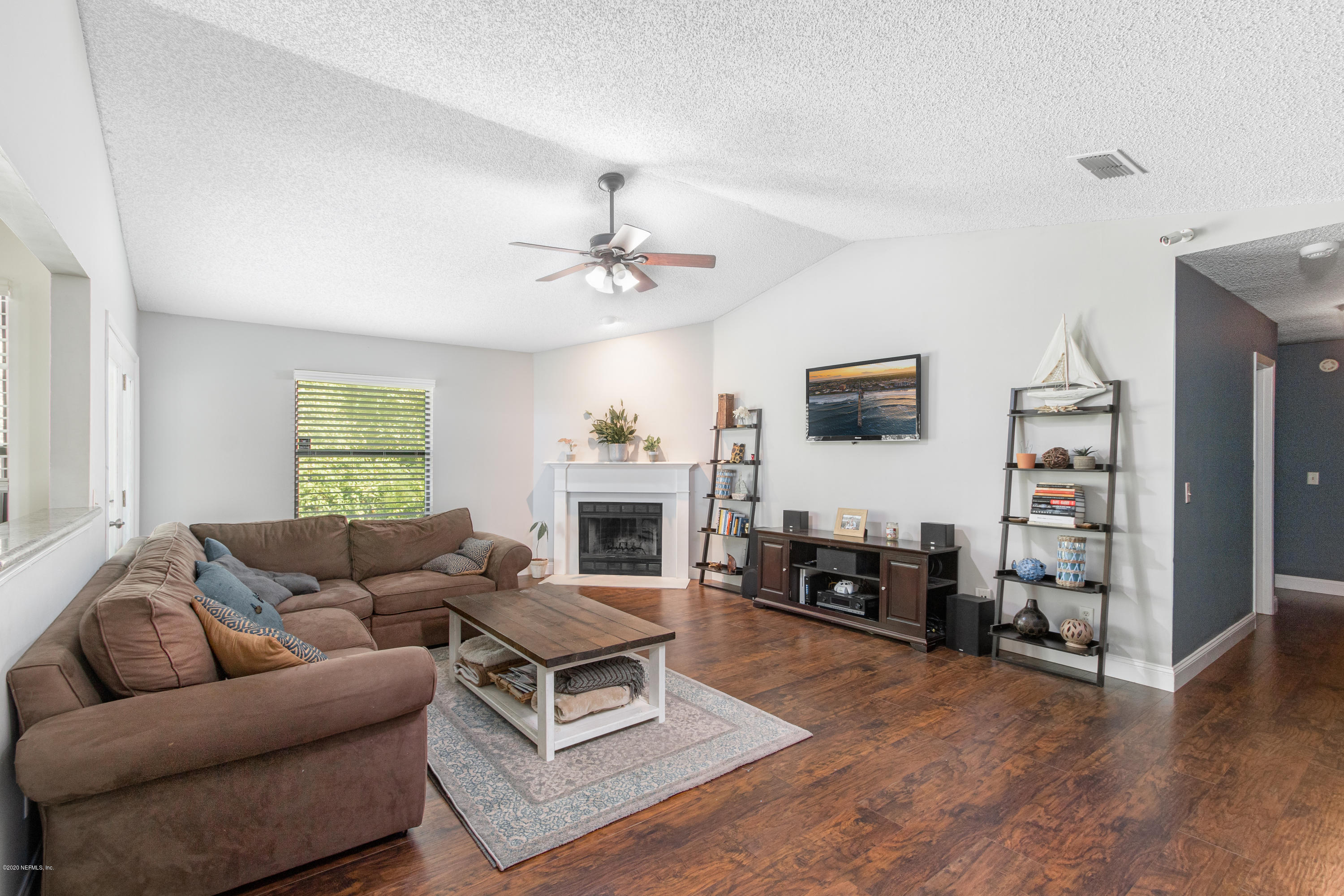 1214 Raleigh Ridge Drive Jacksonville, FL 32225 - Photo 3 of 25 a living room with furniture and a flat screen tv