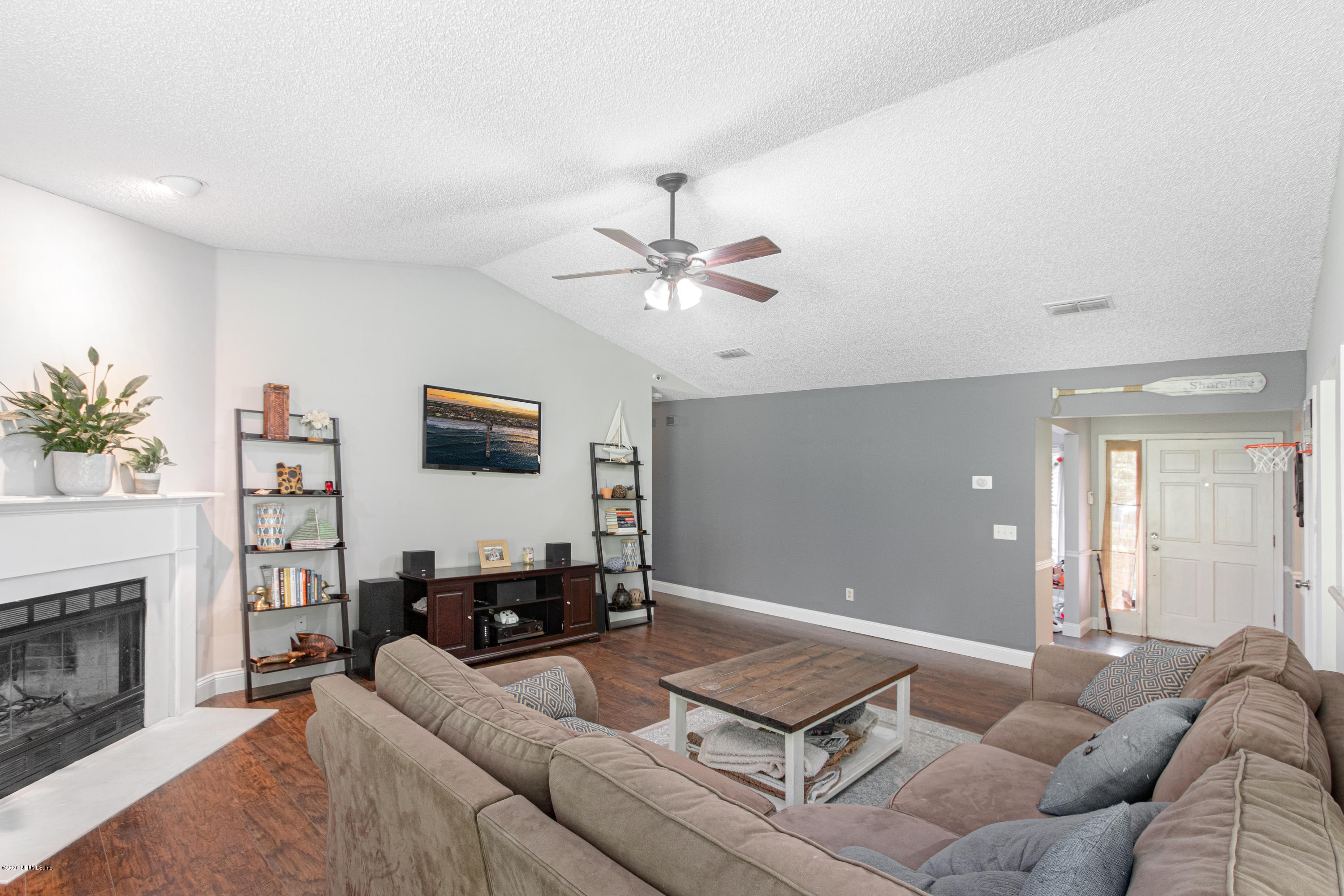 1214 Raleigh Ridge Drive Jacksonville, FL 32225 - Photo 4 of 25 a living room with furniture and a fireplace