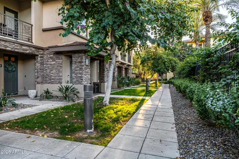 a view of a house with fountain bath tub and palm trees