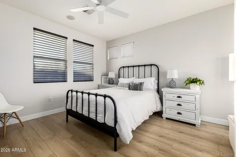 a spacious bedroom with a bed and a window