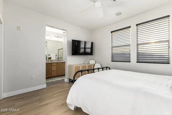 a bedroom with a bed and a television