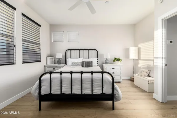 a bedroom with a bed and a window