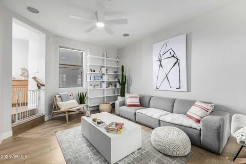 a living room with furniture or couch and a table