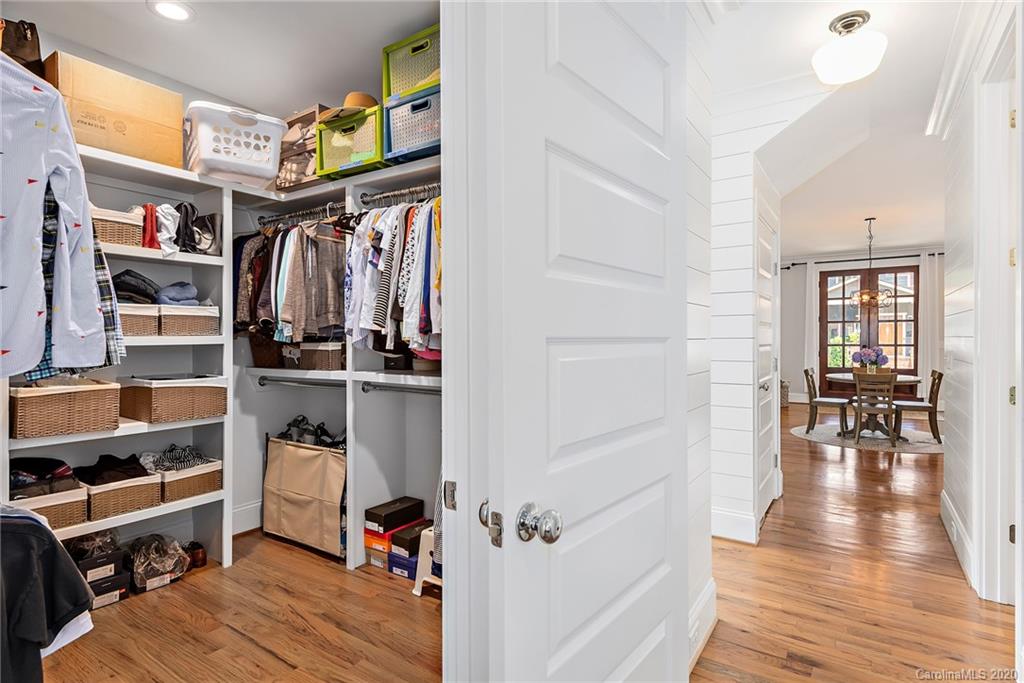 206 Mill Road Charlotte, NC 28216 - Photo 14 of 26 a view of walk in closet with clothes and shoes