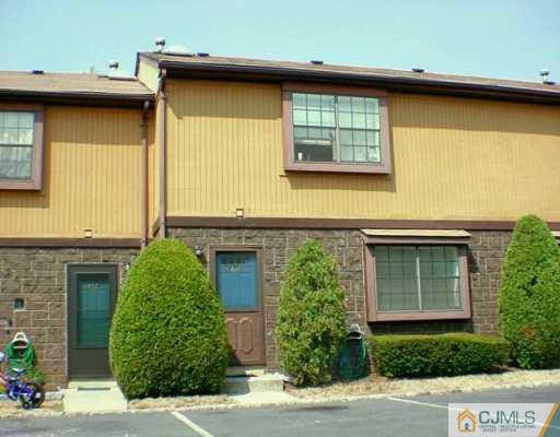 5305 Hana Road Edison, NJ 08817 - Photo 1 of 2 a front view of a house with garden