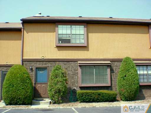 5305 Hana Road Edison, NJ 08817 - Photo 2 of 2 a front view of a house with garden