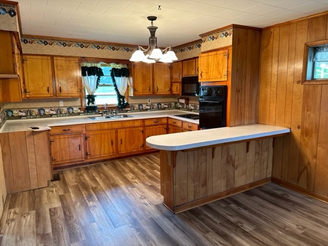 3950 Viola Road McMinnville, TN 37110 - Photo 11 of 26 a large kitchen with stainless steel appliances a large counter space and a sink