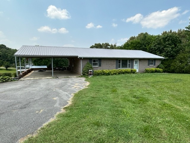 3950 Viola Road McMinnville, TN 37110 - Photo 2 of 26 a front view of a house with garden