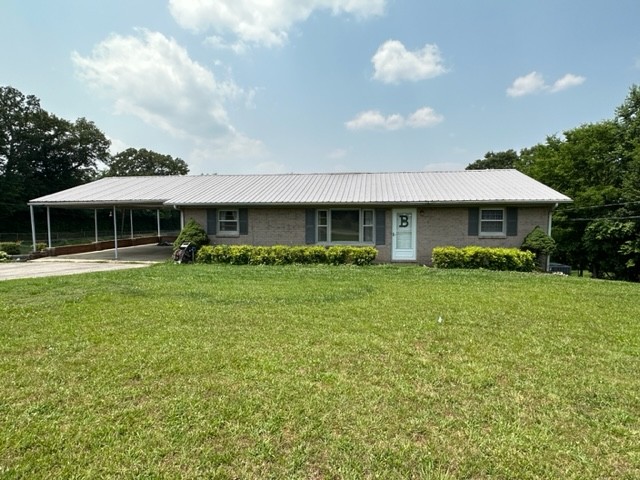 3950 Viola Road McMinnville, TN 37110 - Photo 3 of 26 a front view of a house with a yard