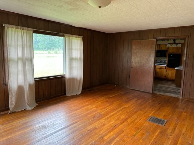 3950 Viola Road McMinnville, TN 37110 - Photo 8 of 26 an empty room with wooden floor and windows