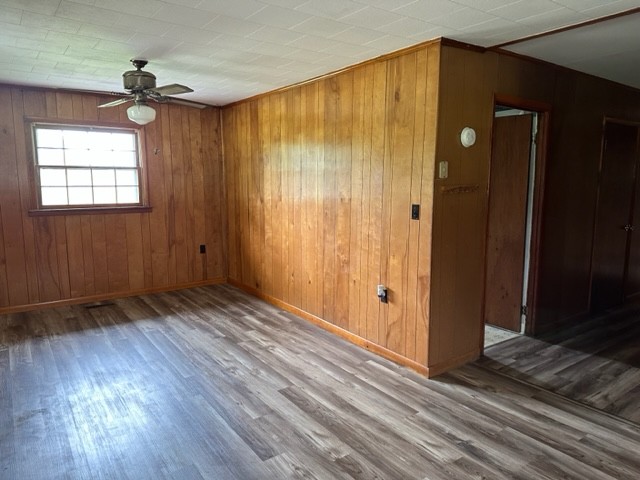 3950 Viola Road McMinnville, TN 37110 - Photo 10 of 26 an empty room with wooden floor and a window