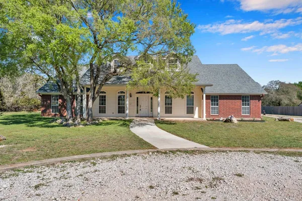 front view of a house with a yard