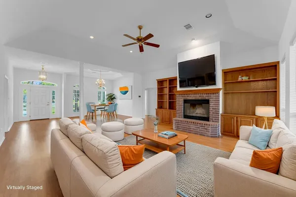 a living room with furniture and a fireplace