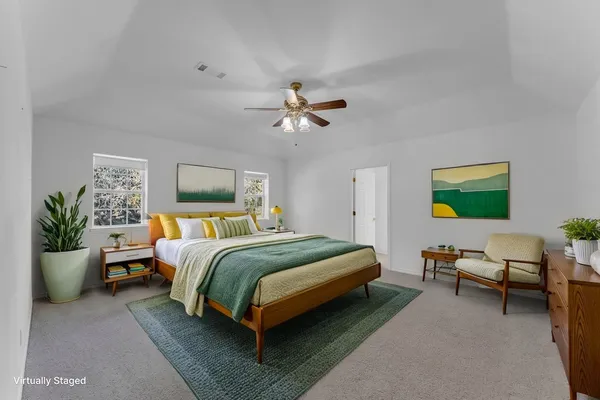 a bedroom with a bed and window