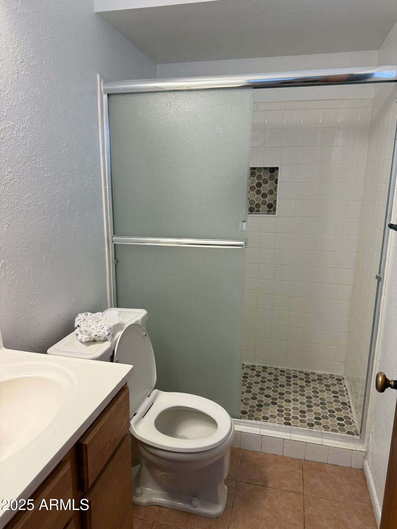 5000 West Osborn Road Phoenix, AZ 85031 - Photo 23 of 23 a bathroom with a shower toilet and sink