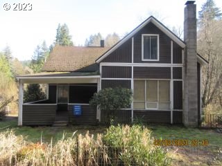 15030 Northwest Cornelius Pass Road Portland, OR 97231 - Photo 1 of 16 a front view of a house with a yard