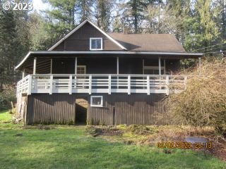 15030 Northwest Cornelius Pass Road Portland, OR 97231 - Photo 2 of 16 a front view of a house with a yard