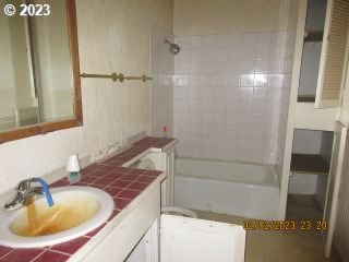 15030 Northwest Cornelius Pass Road Portland, OR 97231 - Photo 5 of 16 a bathroom with a sink and shower