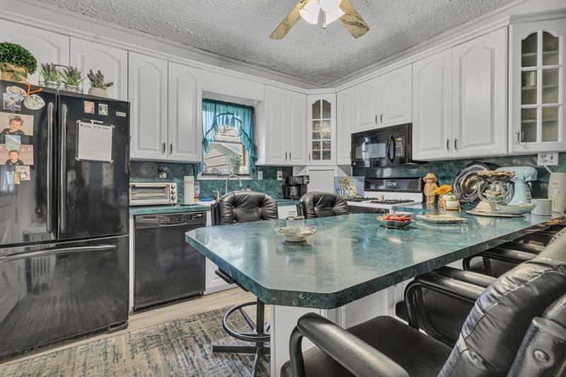 3159 Brodhead Road Aliquippa, PA 15001 - Photo 7 of 30 a kitchen with stainless steel appliances granite countertop a sink a stove and a refrigerator