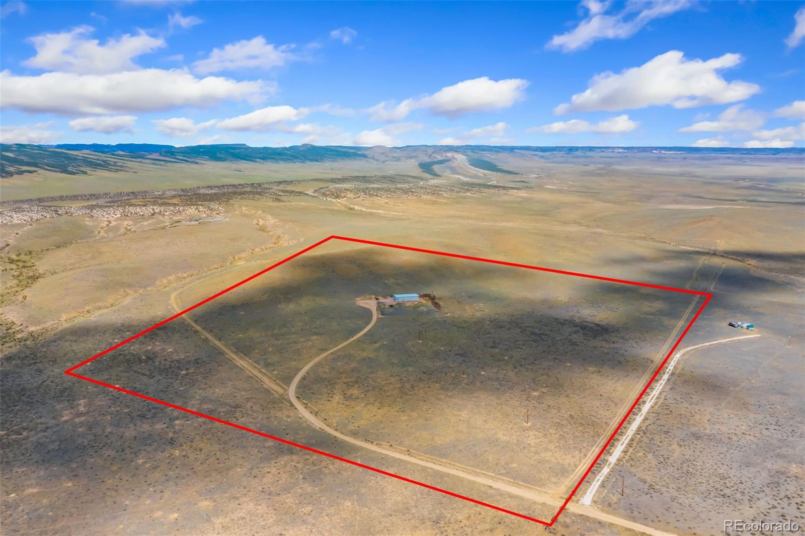 20179 Rawhide Flats Road Wellington, CO 80549 - Photo 3 of 12 a view of an ocean and beach