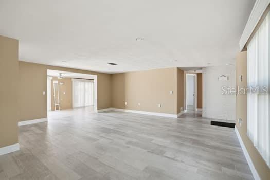 12612 4th Isle Hudson, FL 34667 - Photo 13 of 50 a view of an empty room with a window