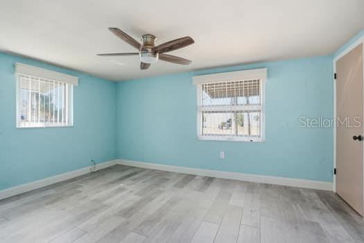 12612 4th Isle Hudson, FL 34667 - Photo 16 of 50 an empty room with a window