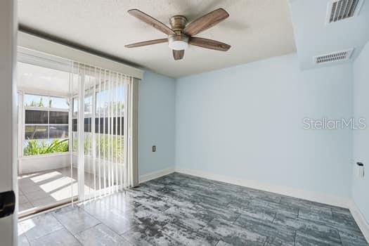 12612 4th Isle Hudson, FL 34667 - Photo 18 of 50 a view of a hallway with a ceiling fan