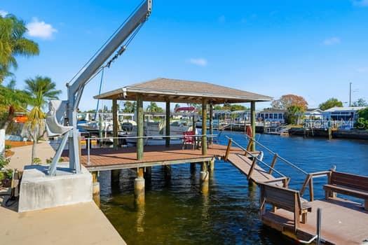 12612 4th Isle Hudson, FL 34667 - Photo 3 of 50 a view of a swimming pool with sitting area