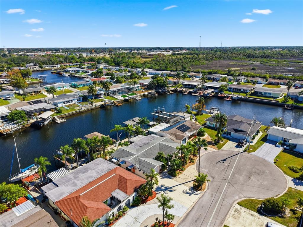 12612 4th Isle Hudson, FL 34667 - Photo 40 of 50 an aerial view of a house with a lake view