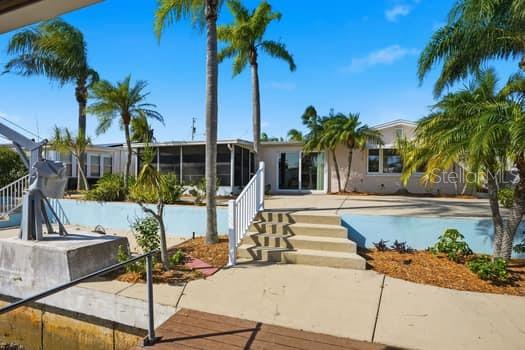12612 4th Isle Hudson, FL 34667 - Photo 7 of 50 a view of a swimming pool with a patio