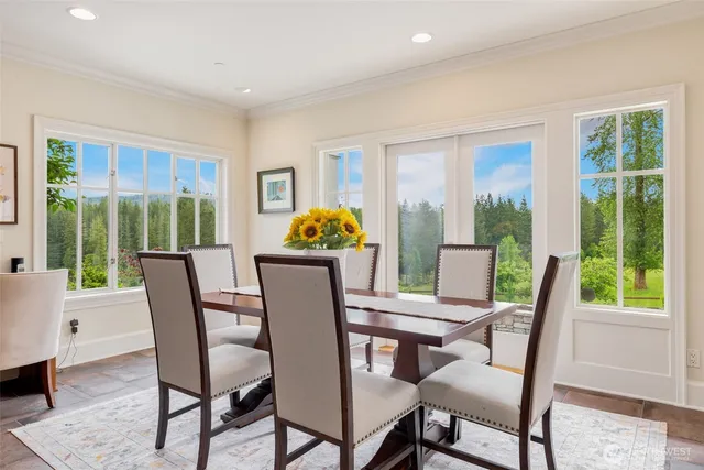 a view of a dining room with furniture window and outside view