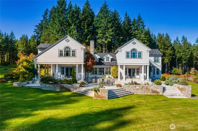 a front view of a house with swimming pool having outdoor seating