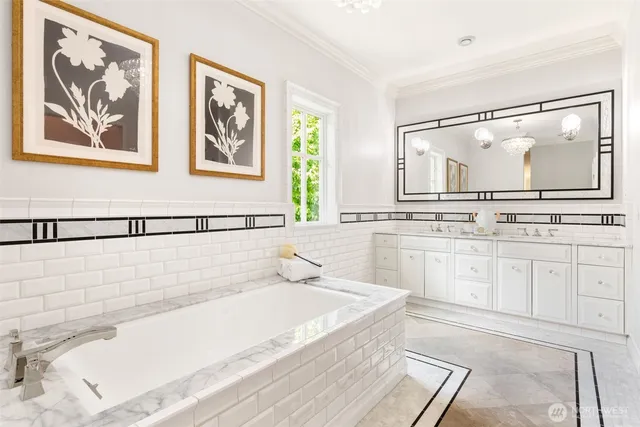 a bath room with a bathtub and a view of bathroom