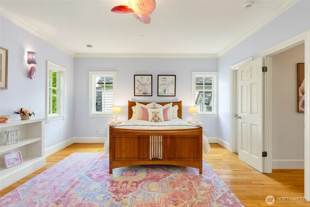 a spacious bedroom with a bed and a window