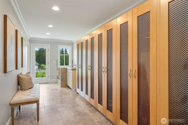 a view of a house with swimming pool and sitting area