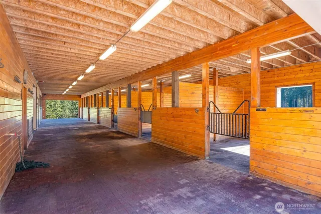 a view of a swimming pool with a patio and a garden