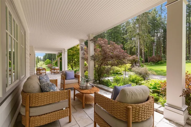 a outdoor living space with furniture and garden view
