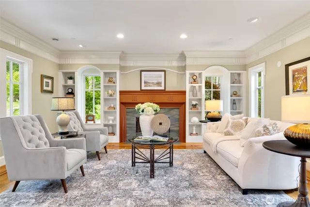 a living room with furniture a rug and a window