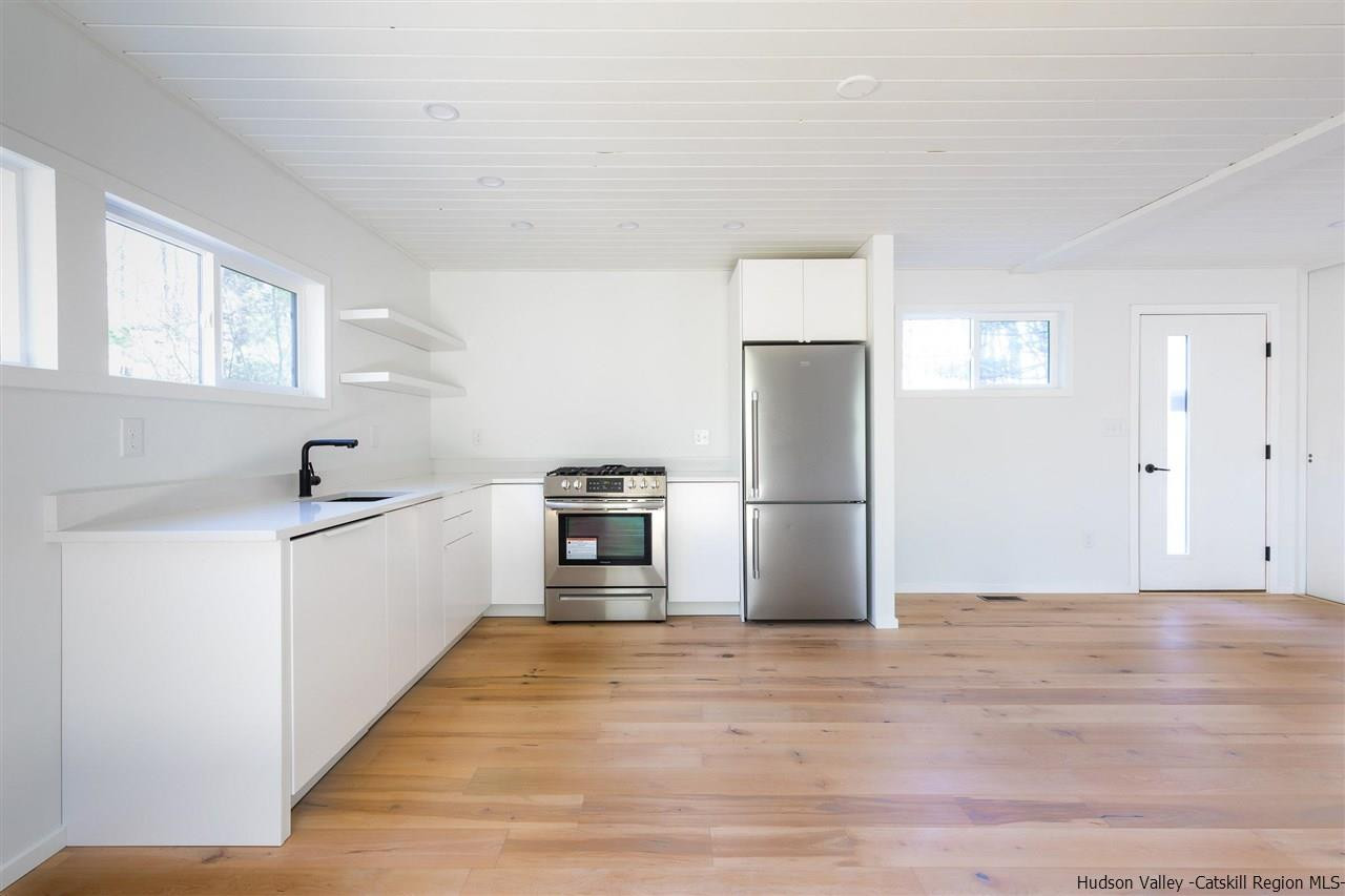25 Upper Cherrytown Road Kerhonkson, NY 12446 - Photo 5 of 14 a kitchen with a refrigerator and a sink