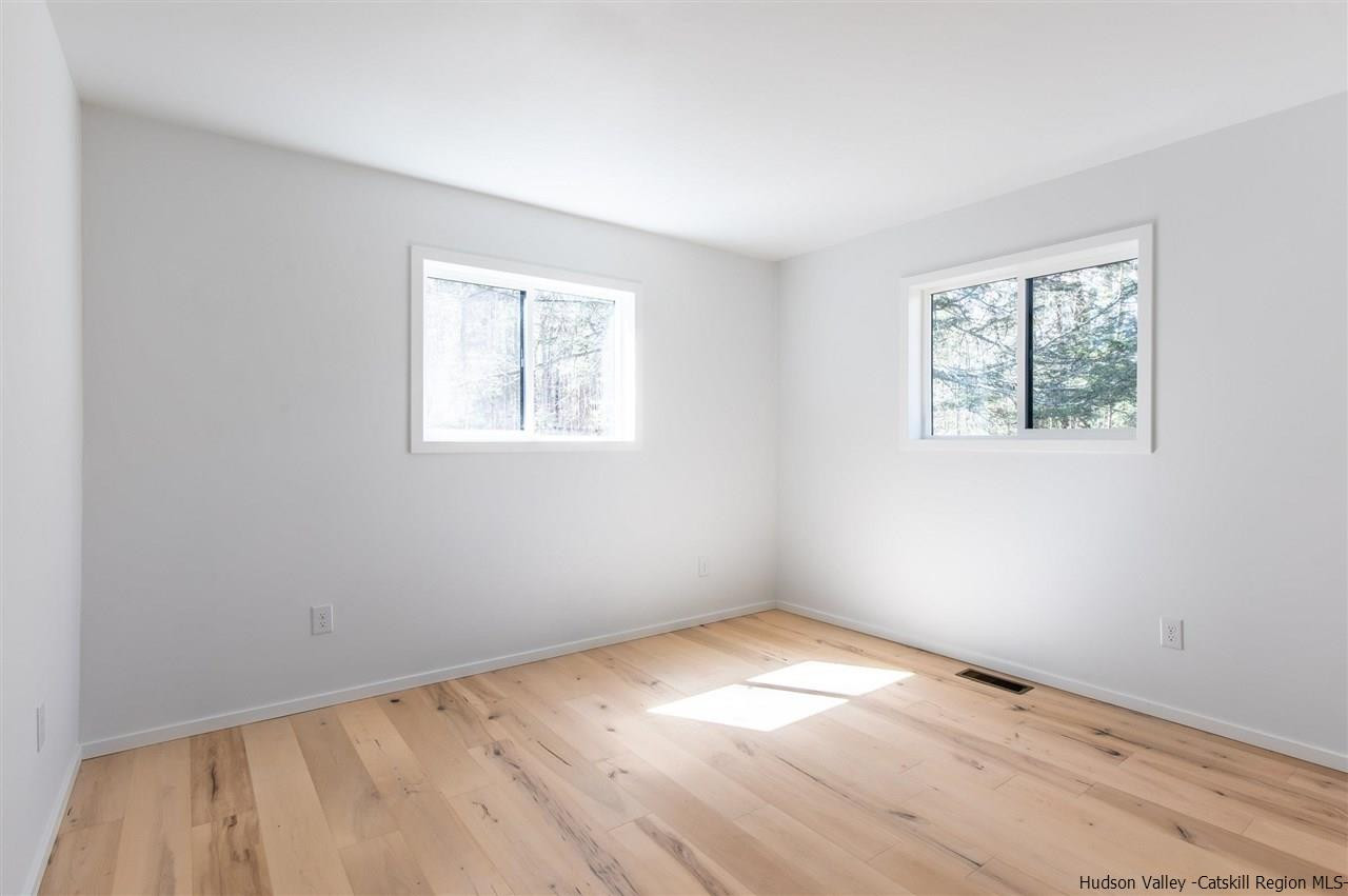 25 Upper Cherrytown Road Kerhonkson, NY 12446 - Photo 8 of 14 an empty room with a window